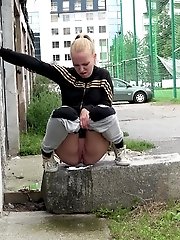 15 pictures - Gorgeous blonde babe pissing in public