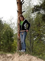 16 pictures - Beautiful teen plays watersports on a quiet forest glade
