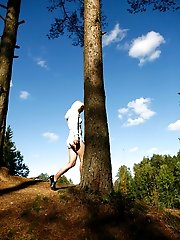 16 pictures - Naughty blonde pisses into a sandpit in forest