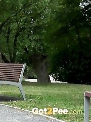 15 pictures - Gorgeous redhead lifts up her legs to piss outside