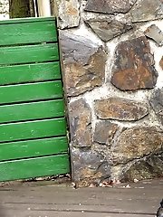 15 pictures - Pretty babe pisses onto a wooden terrace