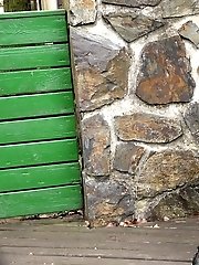 15 pictures - Pretty babe pisses onto a wooden terrace