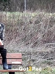 15 pictures - Black haired teen pisses on a wooden bench