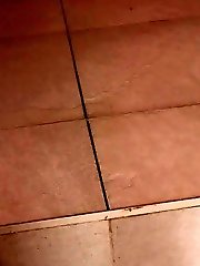 15 pictures - Pretty brunette sprays her piss onto the ground