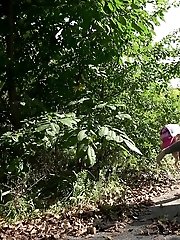 15 pictures - Sexy blonde squatting to pee outside on a road