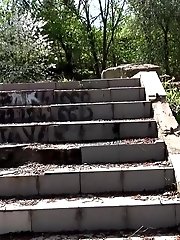 15 pictures - Brunette girl pisses down some concrete steps