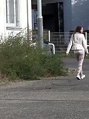 15 pictures - Brunette girl makes a pissy puddle on the road