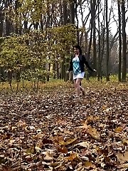 15 pictures - Dark haired babe pees in the woodland