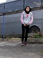15 pictures - Dark haired girl pisses by a public car park