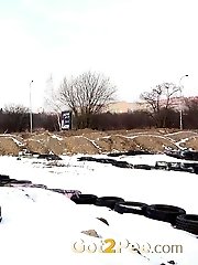 15 pictures - Pretty babe squats in the snow and pisses outside