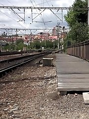 15 pictures - Dark haired European pissing outside in public