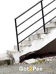 15 pictures - Messy outdoor pissing for raven haired babe