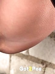 15 pictures - Cute girl in boots pisses outside in the city
